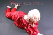 Blonde archive girl posing in a studio wearing a sexy red AGU rainwear combination (Pics)