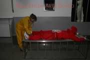 Watching Stella being tied and gagged with ropes and a ballgag on a operating table from Leonie both wearing sexy shiny nylon rainwear (Pics)