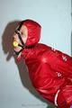 Alina tied and gagged in shiny nylon shorts and a shiny nylon cagoule