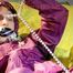 Sonja ties, gagges and hoodes herself with hand cuffs on a bed wearing a supersexy purple rainnwear (Pics)