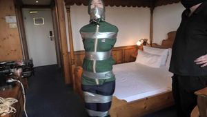 Rachel Adams Poletied and Pantygagged in shiny nylon Rainwear left for desperate struggeling