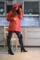 Miss Amira im sexy Lackcatsuit und Regenmantel fixiert und geknebelt
