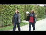Katharina and her friend wearing shiny nylon rainwear while playing soccer (Video)