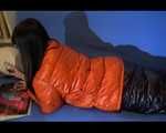 Mara sorting newspapers and lolling on the floor and the sofa wearing sexy shiny nylon downwear (Video)