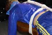 Watching sexy Sonja wearing a sexy shiny nylon shorts in blue and a blue rain jacket being tied and gagged on a stool with ropes and a clothgag (Pics)