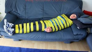 Katharina taped and gagged in a blue nylon rainsuit