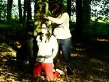 Two girls cuffed to a tree 2/2