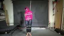 Rachel Adams bound, Pantygagged and Pantyhooded in a shiny nylon Downjacket