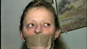 43 YEAR OLD WAITRESS IS TAPE BALL-TIED, TAPE HOG-TIED, BAREFOOT, TOE-TIED & WRAP TAPE GAGGED (D62-10)