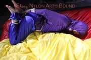 Sonja tied, gagged and hooded with ropes and a cloth gag on the sofa wearing a supersexy blue rain pants and a purple rain jacket (Pics)