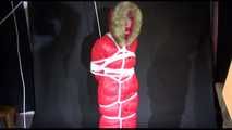 ***SEXY MARA*** wearing a supersexy black shiny nylon pants and a red shiny nylon down jacket with a coat being bound overhead with ropes and a ball gag (Video)