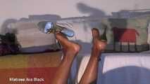 Strappy heels up in the air