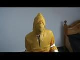 Jill tied and gagged on a chair wearing a yellow rainsuit and coveres with an yellow raincoat with two hoods (Video)
