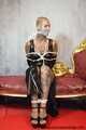 Miss Francine bound and gagged with layers of gags in a sexy PVC dress