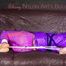*** HOT HOT HOT*** NEW MODELL*** SANDRA wearing a sexy transparent purple shiny nylon pants and a purple down jacket tied and gagged on a sofa with ropes hand to feet and a cloth gag (Pics)