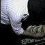 LEATHER SKIRT, HOG-TIED, TOE-TIED, MOUTH STUFFED HOSTAGE (D17-18)
