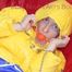 Sonja tied, gagged and hooded on a sofa wearing a sexy blue rain pants and a yellow downwear jacket (Pics)