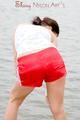 Enni having a good time outdoor wearing sexy shiny nylon shorts and a top posing for the camera (Pics)