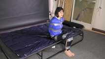 Lana tied and gagged in shiny nylon Rainwear desperately trying to free herself