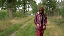 Miss Petra takes a walk in an AGU rain suit and rubber boots