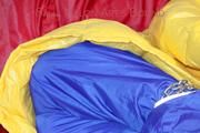 Sonja tied, gagged and hooded on a sofa wearing a sexy blue rain pants and a yellow downwear jacket (Pics)