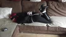 Angi hogtied on couch 2/2