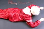 Blonde archive girl posing in a studio wearing a sexy red AGU rainwear combination (Pics)