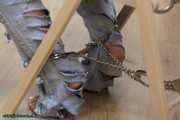 Hot jeans girl cuffed on a chair
