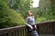 Miss Petra in a hot vinyl skirt, high heels and transparent blouse at photo shooting