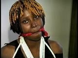 21 Yr OLD BLACK COLLEGE STUDENT GETS BANDANA CLEAVE GAGGED, CHAIR TIED  WEARING BLACK LINGERIE, GARTER BELT & HIGH HEELS (D65-3)