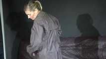 Watching sexy Sandra wearing a supersexy long rainwear skirt trying on several rain coats with hoods (Video)