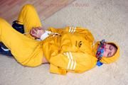 Katharina tied and gagged in a yellow rainsuit