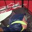 Pia tied and gagged on a princess bed in an old cellar wearing a sexy black rain pants and a darkblue/green down jacket (Video)