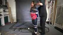 Marie bound and gagged in shiny nylon Rainwear