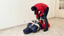 Breathplay Sebastien in a puffer jacket in hogtied.