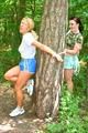 Jill ties and gagges an archive girl outdoor on a tree both wearing shiny nylon shorts and shirts (Pics)