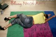 Stella posing in a living room wearing supersexy rainwear (Pics)