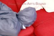 Jill tied, gagged and hooded with ropes on as sofa wearing a blue shiny nylon shorts and a blue oldschool rain jacket (Pics) 