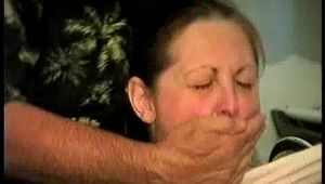 46 Yr OLD REAL ESTATE AGENT'S IS MOUTH STUFFED, WRAP VET TAPE GAGGED, CLEAVE GAGGED, HANDGAGGED AND IS TIGHTLY TIED TO A CHAIR (D66-5)