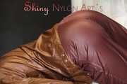 Watching ***SONJA*** wearing a sexy brown shiny nylon rainwear combination preparing her bed an lolling in the bed (Pics)