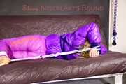 *** HOT HOT HOT*** NEW MODELL*** SANDRA wearing a sexy transparent purple shiny nylon pants and a purple down jacket tied and gagged on a sofa with ropes hand to feet and a cloth gag (Pics)