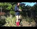 Mara wearing only a hot rain jacket and rubber boots lingering in the garden taking a shower (Video)