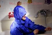 Sonja ties, gagges and hoodes herself in a bath tub wearing supersexy shiny nylon rainwear (Pics)