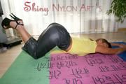 Stella posing in a living room wearing supersexy rainwear (Pics)