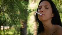 Elizaveta is smoking two all white cigs in a row