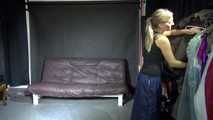 Watching sexy Sandra wearing a supersexy long rainwear skirt trying on several rain coats with hoods (Video)