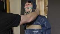 Lana tied and gagged and gagged to Post in shiny nylon Rainwear