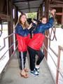 two of our archive girls in shiny nylon rainwear and bondage