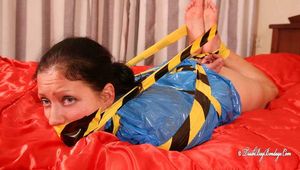 Elsa - captured, tape tied and hogtaped in trashbag
