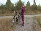 Get a Video with Sandra riding her bike enjoying her shiny nylon Rainwear